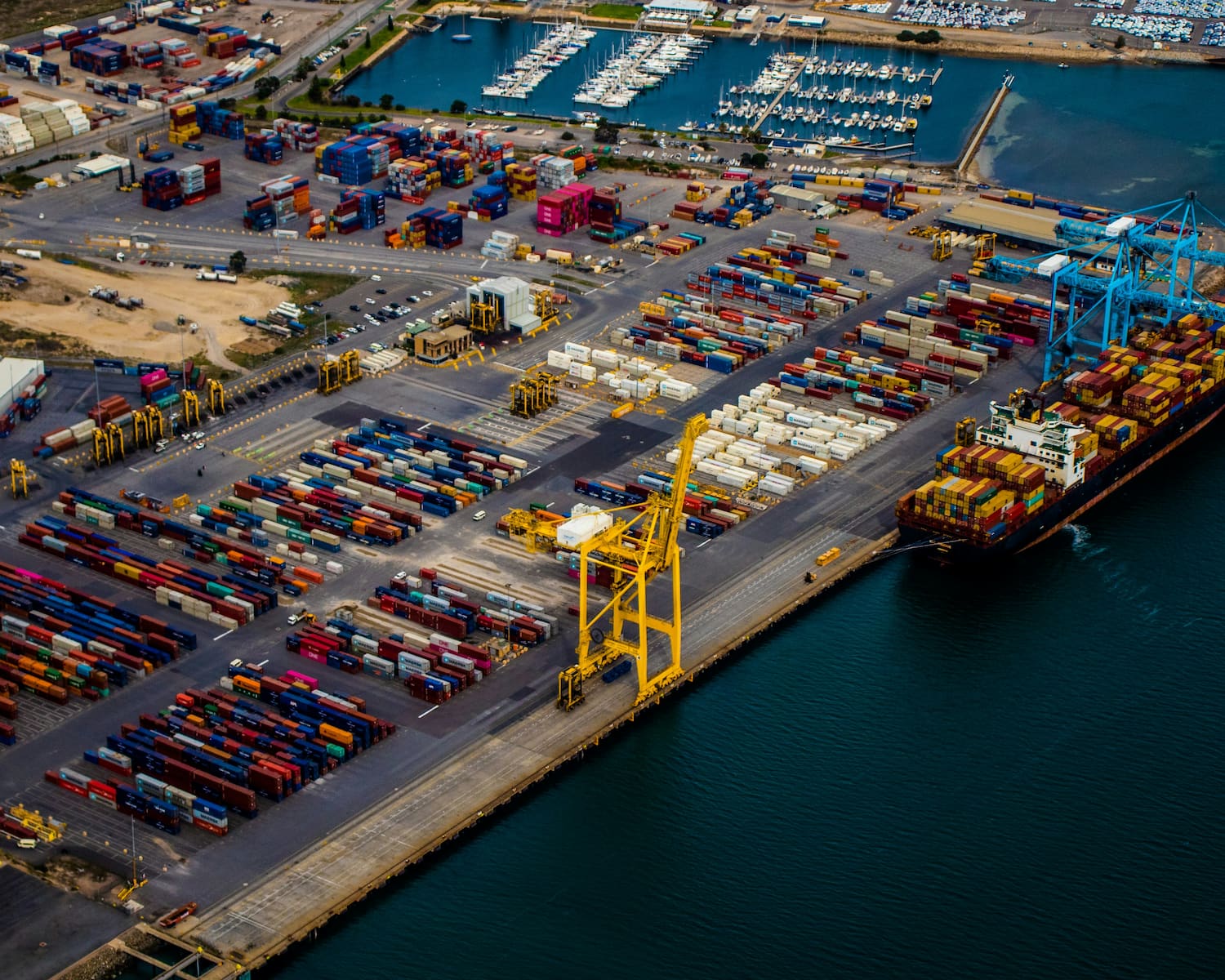 An aerial view of a working cargo port and waterfront